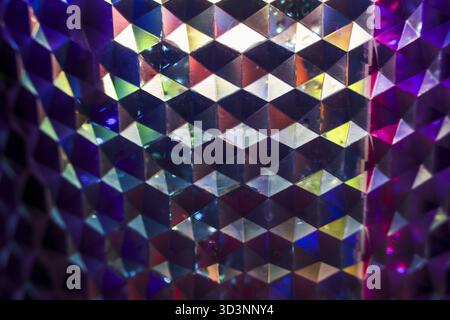 Mesmerizing abstract background with holographic geometric pattern. vibrant, iridescent surface reflects light, creating shimmering, colorful, and psy Stock Photo