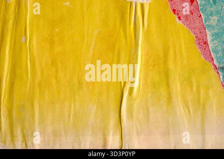 Old blank colorful ripped torn grunge posters backgrounds creased crumpled paper backdrop surface placard empty space for text Stock Photo