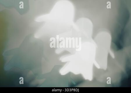 White ghost bokeh on black background – abstract foggy Halloween lights, front view. Stock Photo