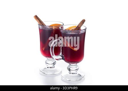Mulled Wine with Orange and Cinnamon Sticks and Christmas decoration isolated on white background Stock Photo