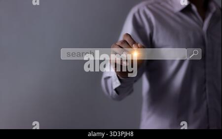 Young man with smartphone mobile hand using a pen touching to search bar, Search job Stock Photo
