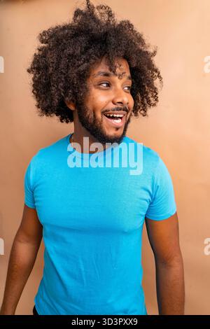 Black man wearing blue t-shirt laughing Stock Photo