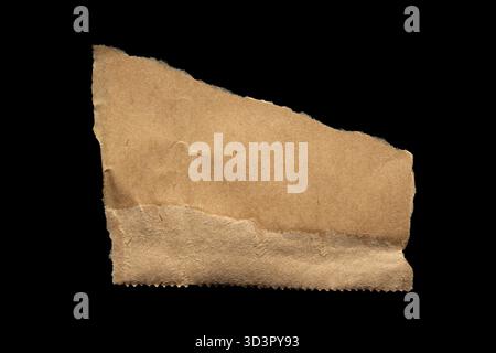 Brown torn paper piece isolated on black background Stock Photo