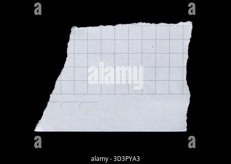 Torn graph paper piece isolated on black background Stock Photo