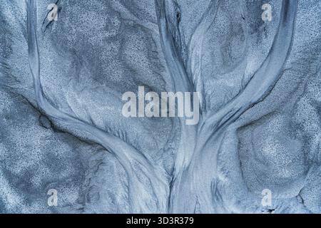 A captivating abstract image showcasing intricate dark gray patterns reminiscent of tree branches against a textured light gray background, creating a Stock Photo
