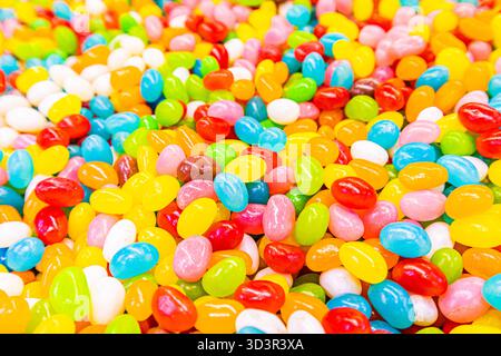 A delightful assortment of vibrant and colorful jelly candies fills the image. The bright and cheerful candies create a playful atmosphere, perfect fo Stock Photo