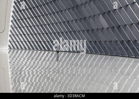 Chongqing, China - 13 October 2025: View of the West Station's sleek, modern architecture, where light and shadow dance across the polished floors, cr Stock Photo