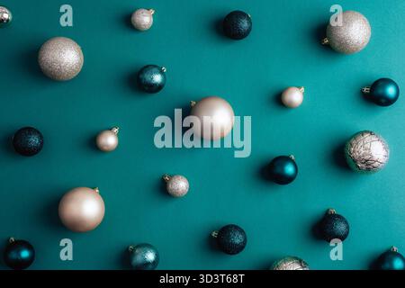 Dark green and silver Christmas balls on green background, texture. Stock Photo