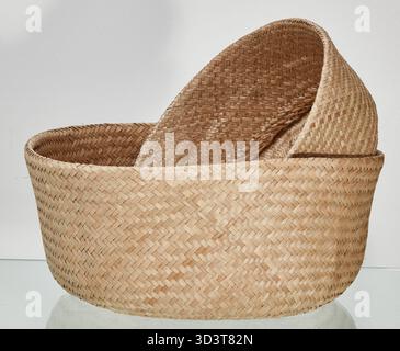 Two stacked baskets made from dried natural fibers isolated nature background with clipping path Stock Photo