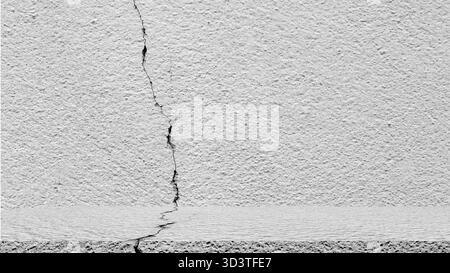 Close up of cracked concrete wall texture showing damage, construction defect, and building surface problem, concept for repair, maintenance, and home Stock Photo
