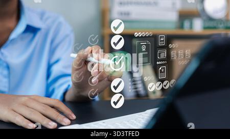 Business person using digital checklist and workflow management system on virtual screen, concept of productivity, task tracking, and digital transfor Stock Photo
