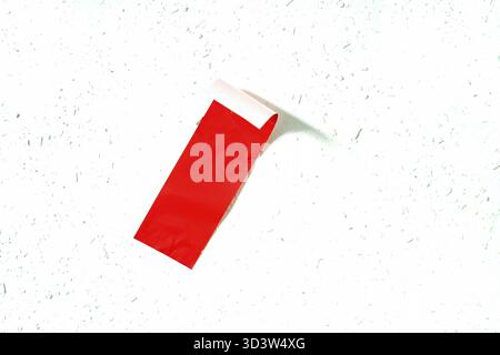 Art concept, the absence of the banana behind the red adhesive tape, white woodchip wallpaper as a background, in Horn-bad Meinberg, North Rhine-Westp Stock Photo
