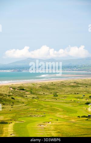 Golf course next to the Harlech Castle (Castell Harlech) and dunes, Harlech, Gwynedd, Wales Stock Photo