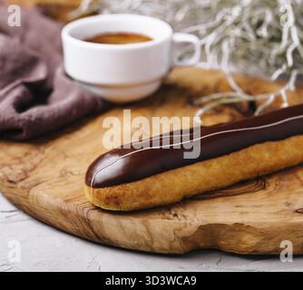 Food, Eclairs with chocolate and a coffee cup Stock Photo