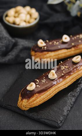 Food, French eclairs with chocolate and hazelnuts Stock Photo