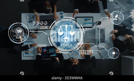 A top-down view of diverse professionals discussing AI ethics in a corporate setting, emphasizing the importance of responsible innovation and Stock Photo