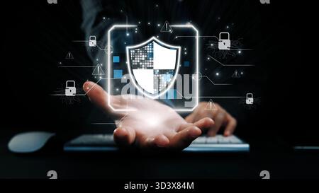 A conceptual image showcasing a hand holding a glowing shield symbol representing digital cybersecurity, surrounded by alert icons, illustrating Stock Photo