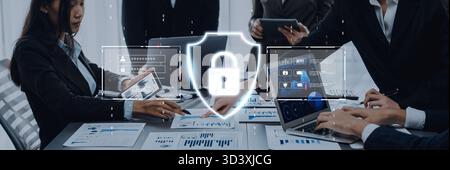Business professionals engage in a meeting focused on cybersecurity strategies, discussing data protection methods with digital symbols at a Stock Photo