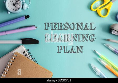 Blue background with a clock, scissors, pens, and pencils. The words personal learning plan are written in black on the background Stock Photo