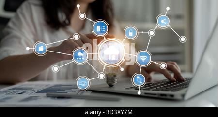 A business professional engages in digital tasks on a laptop, surrounded by cloud technology symbols, showcasing innovation and data-driven strategies Stock Photo
