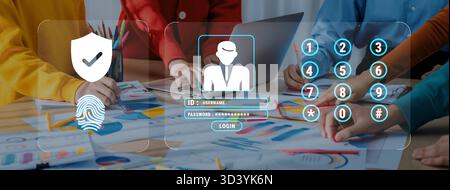 Diverse professionals engage in a collaborative session focusing on digital security and login methods while analyzing financial data in a modern Stock Photo