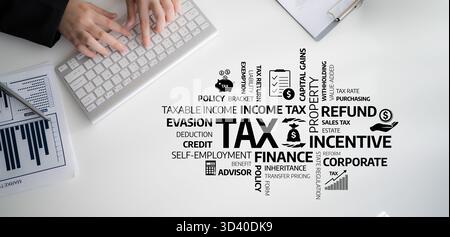 A close-up of hands working on a keyboard surrounded by various tax-related terms and financial charts, highlighting key concepts in taxation and Stock Photo