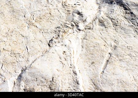 Real natural grunge rusted raw white marble stone surface texture as extracted from the mountain. Stock Photo