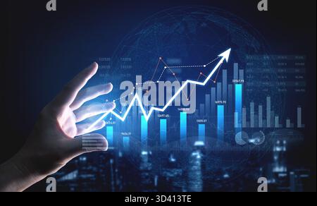 A futuristic digital setting shows a hand gesturing towards dynamic graphs and charts representing growth in finance, illustrating data analysis and Stock Photo