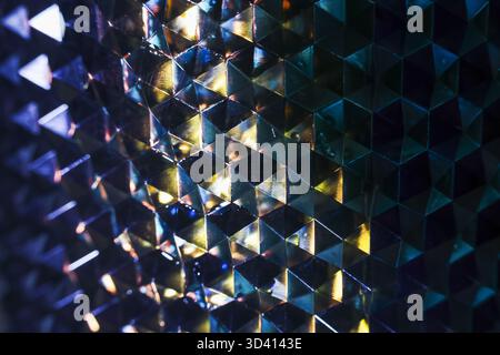 Mesmerizing abstract background with geometric pattern of blue and gold hexagons. glowing crystal texture and sharp futuristic design create sophistic Stock Photo