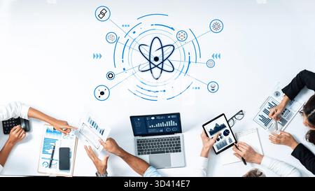 Dynamic collaborative workspace showcasing modern technology and scientific themes, featuring data analysis tools and team interaction for innovative Stock Photo
