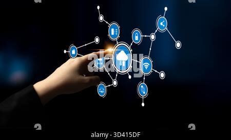 A hand reaches towards a graphic interface displaying cloud technology, showcasing connections and interactions in an advanced digital network Stock Photo