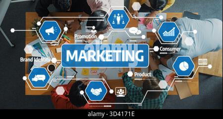 A dynamic creative session showcasing a diverse team collaborating on innovative marketing strategies in a modern workspace, focusing on brand Stock Photo