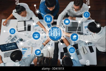 A diverse team collaborates in a modern office setting, focusing on digital marketing strategies with data analytics while utilizing various Stock Photo