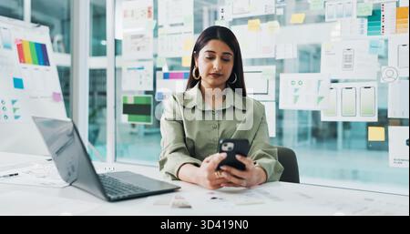 Business woman, web designer or phone with laptop for planning, strategy or UX in office. Female person, developer or computer on mobile smartphone Stock Photo