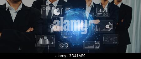Business professionals stand together with arms crossed, showcasing confidence in front of a glowing digital globe and advanced data visualization Stock Photo