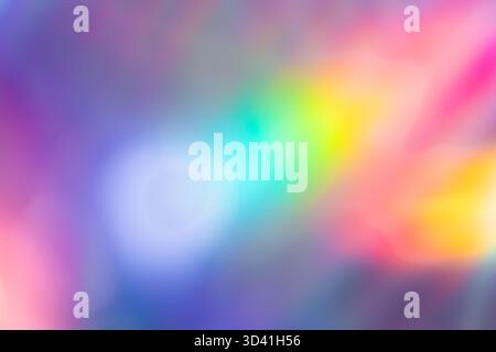 Soft colorful abstract background with blurred light reflections in purple, blue, and pink tones, creating a dreamy gradient texture. Stock Photo