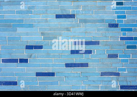 Background from a wall made of small blue stone tiles Stock Photo