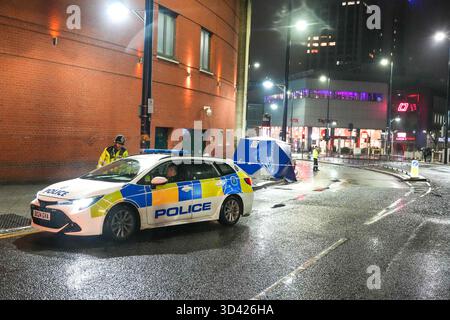 Smallbrook Queensway, Birmingham, Nov 8th 2025 - West Midlands Police closed a section of road directly outside Birmingham's Bullring shopping centre and New Street Station after a woman was stabbed in the neck on Friday evening, a man in his 20's has been arrested. Several forensic tents were erected close to a bus stop. Two small silver tents and a large blue evidential tent were placed on the pavement around a small cordon that closed the road off. Two police officers remained at the scene throughout the night. West Midlands Police Statement: A man is in custody after a stabbing in Birmingh Stock Photo
