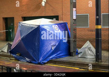 Smallbrook Queensway, Birmingham, Nov 8th 2025 - West Midlands Police closed a section of road directly outside Birmingham's Bullring shopping centre and New Street Station after a woman was stabbed in the neck on Friday evening, a man in his 20's has been arrested. Several forensic tents were erected close to a bus stop. Two small silver tents and a large blue evidential tent were placed on the pavement around a small cordon that closed the road off. Two police officers remained at the scene throughout the night. West Midlands Police Statement: A man is in custody after a stabbing in Birmingh Stock Photo