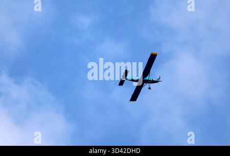 Airplane in a blue sky Stock Photo