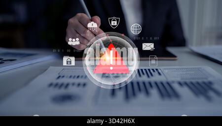 Red warning triangle representing a cybersecurity threat or data breach alert, surrounded by digital security and network protection icons Stock Photo