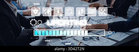 Professionals Engaged in Collaborative Project Planning as Digital Progress Indicators and Graphical Elements Display on Screen in Modern Office Stock Photo