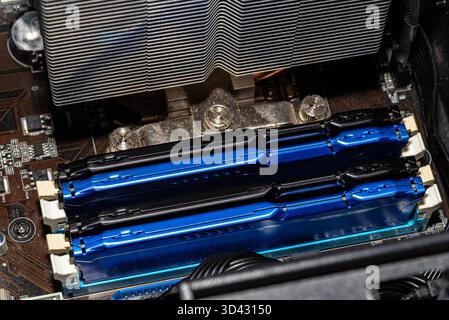 RAM modules plugged into DIMM slots on the motherboard in a dual channel system. Stock Photo