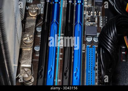 RAM modules plugged into DIMM slots on the motherboard in a dual channel system. Stock Photo