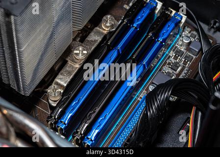 RAM modules plugged into DIMM slots on the motherboard in a dual channel system. Stock Photo