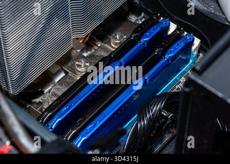RAM modules plugged into DIMM slots on the motherboard in a dual channel system. Stock Photo