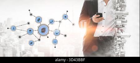 A business professional interacts with a smartphone against a modern cityscape, featuring digital connections that symbolize innovation and technology Stock Photo