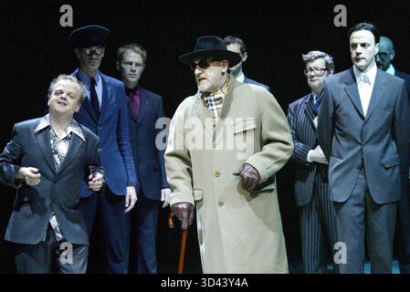 left: Toby Jones (Lucio)  centre: David Troughton (Vincentio, in disguise)  right: Paul Rhys (Angelo) in MEASURE FOR MEASURE by Shakespeare at the Olivier Theatre, National Theatre, London SE1  27/05/2004  a NT & Complicite co-production  set design: Tom Pye  costumes: Christina Cunningham  lighting: Paul Anderson  director: Simon McBurney Stock Photo