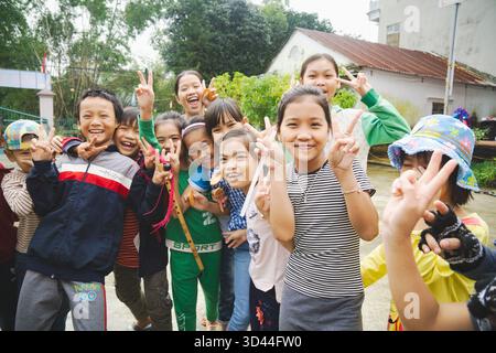 School children playing and laughing in Hue, Viet Nam Stock Photo