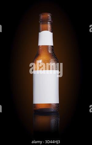 Beer bottle with a blank label on a black background Stock Photo